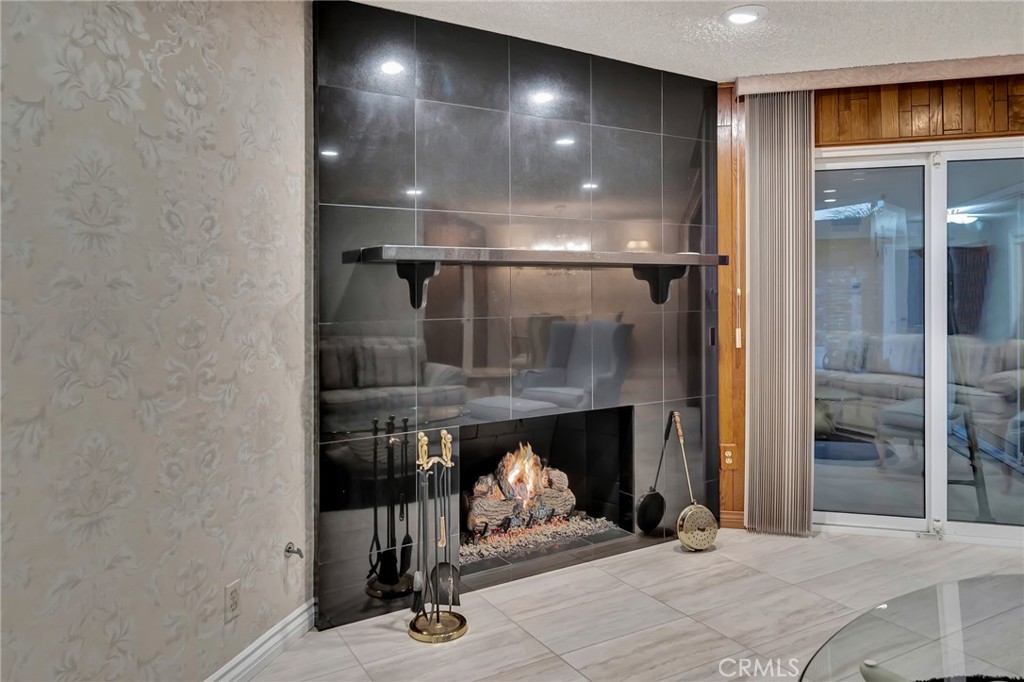 24206 St Edens Circle West Hills, CA 91307 - Photo 28 of 52 a room with fireplace and a wooden floor