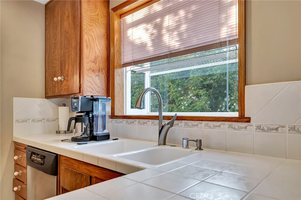 24206 St Edens Circle West Hills, CA 91307 - Photo 37 of 52 a view of a kitchen with a sink and a large window