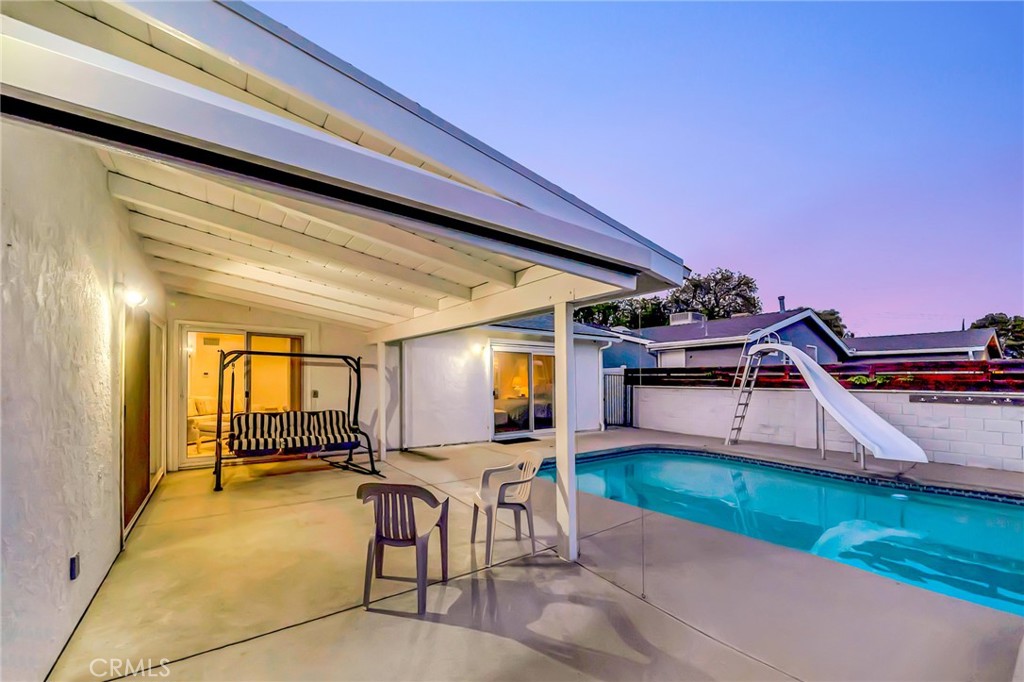 24206 St Edens Circle West Hills, CA 91307 - Photo 5 of 52 a view of a patio with a table and chairs