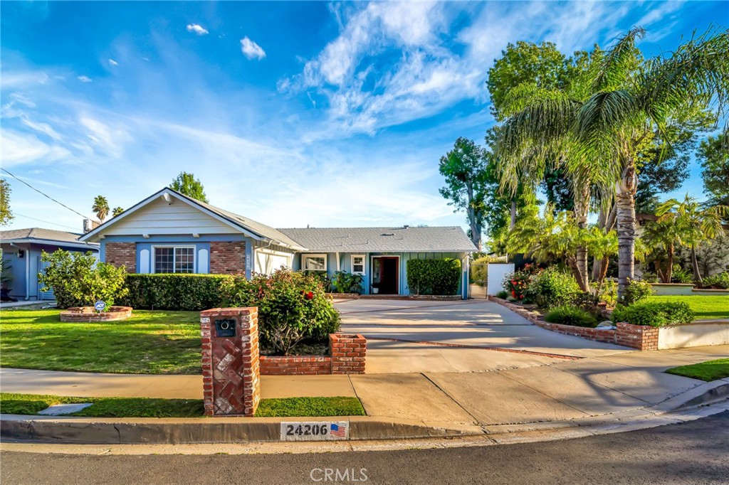 24206 St Edens Circle West Hills, CA 91307 - Photo 51 of 52 a front view of a house with a yard
