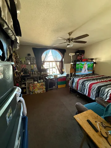 a bedroom with furniture and a chandelier