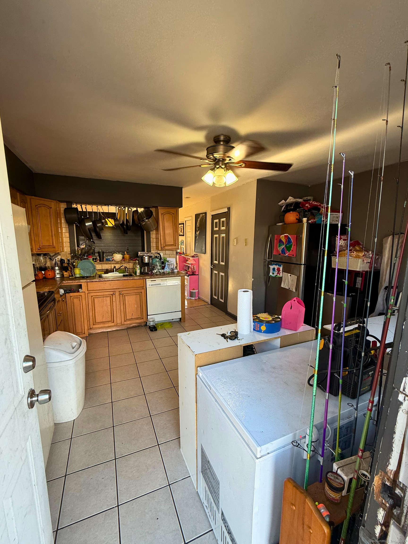 975 Meriden Road, Unit 20 Waterbury, CT 06705 - Photo 8 of 10 a kitchen with a sink appliances and cabinets
