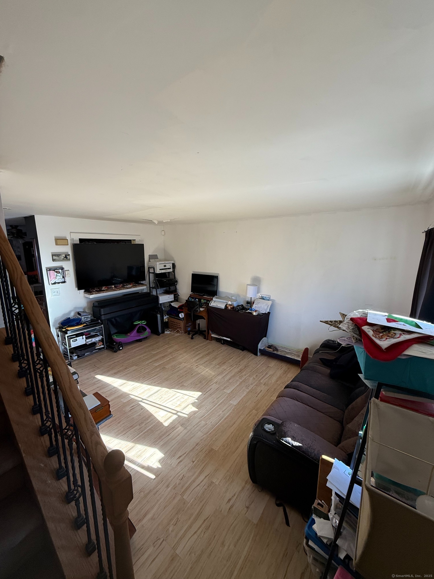 975 Meriden Road, Unit 20 Waterbury, CT 06705 - Photo 10 of 10 a room with furniture and a flat screen tv