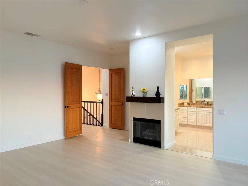564 Vía Pueblo Riverside, CA 92507 - Photo 21 of 36 a view of an empty room with a fireplace and a window