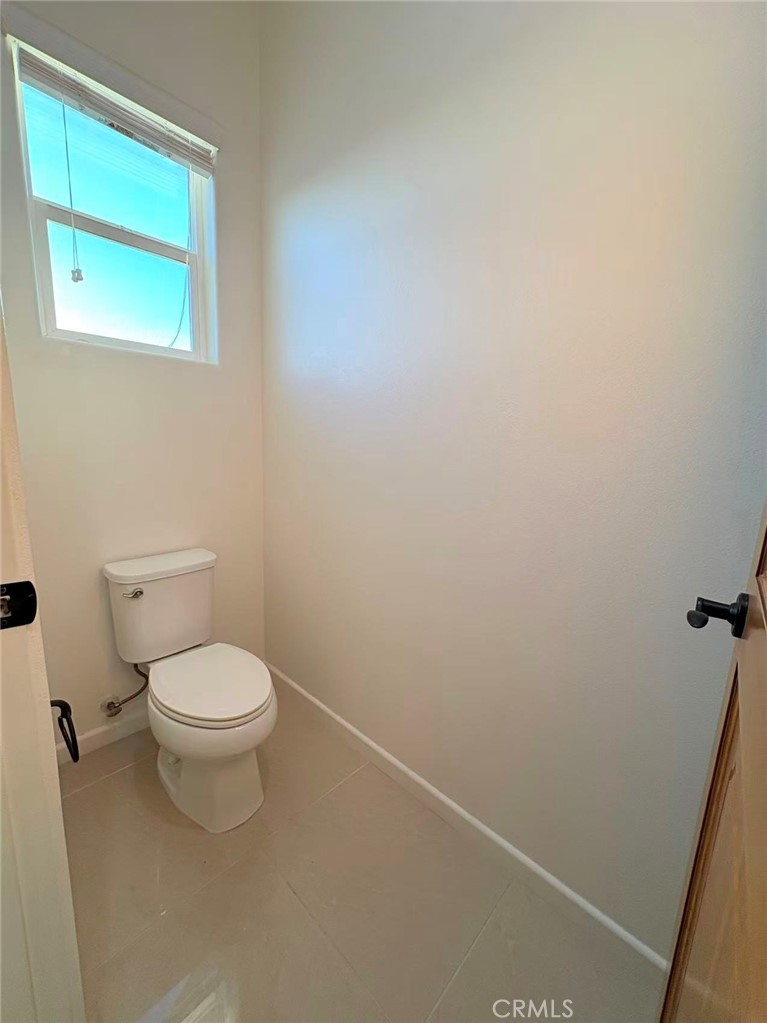 564 Vía Pueblo Riverside, CA 92507 - Photo 26 of 36 a white toilet sitting next to a sink