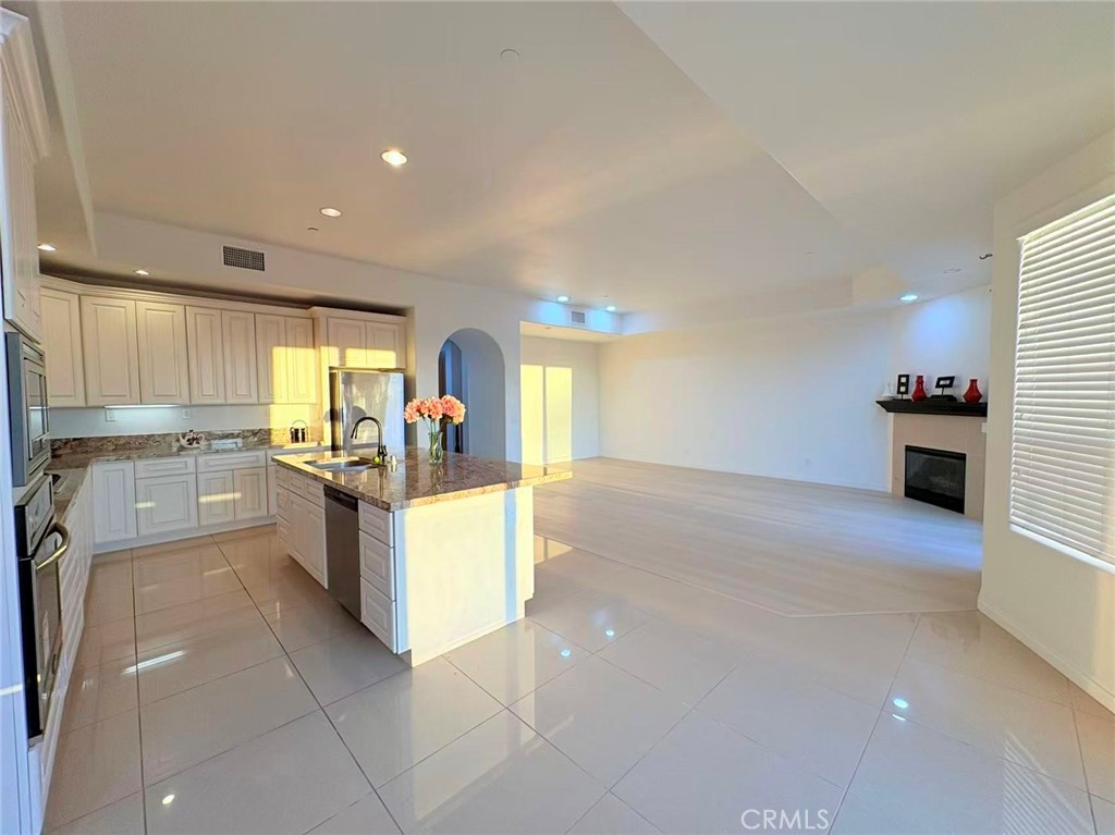 564 Vía Pueblo Riverside, CA 92507 - Photo 3 of 36 a large kitchen with a large counter top appliances and cabinets