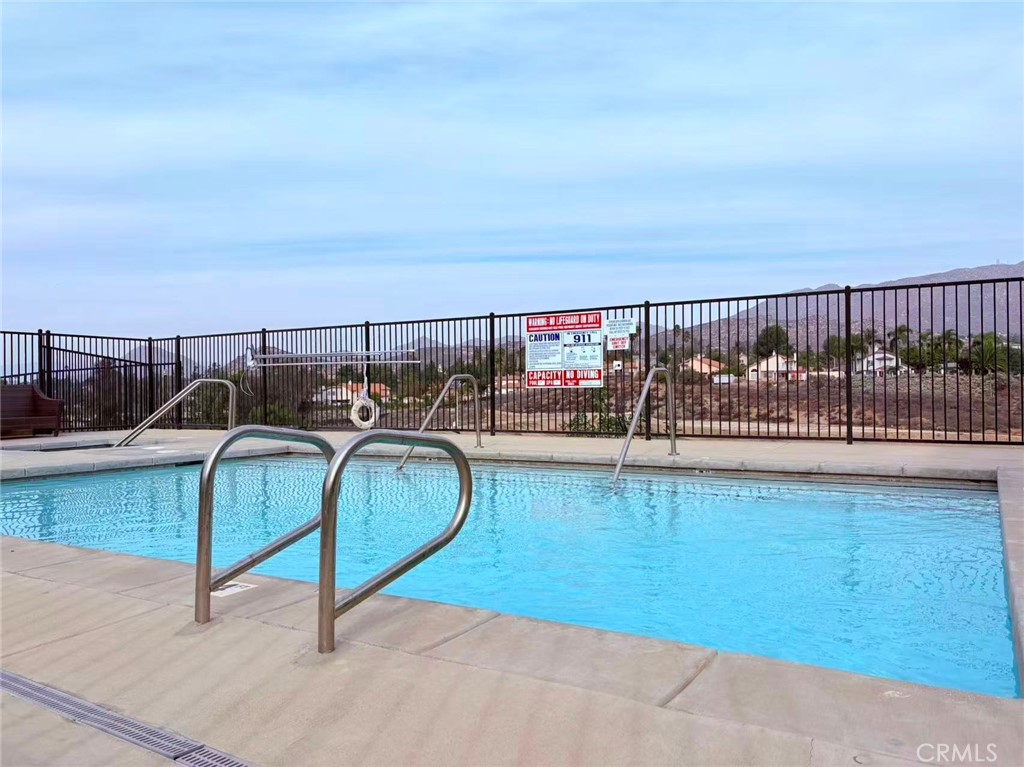 564 Vía Pueblo Riverside, CA 92507 - Photo 34 of 36 a view of a swimming pool with a lounge chair