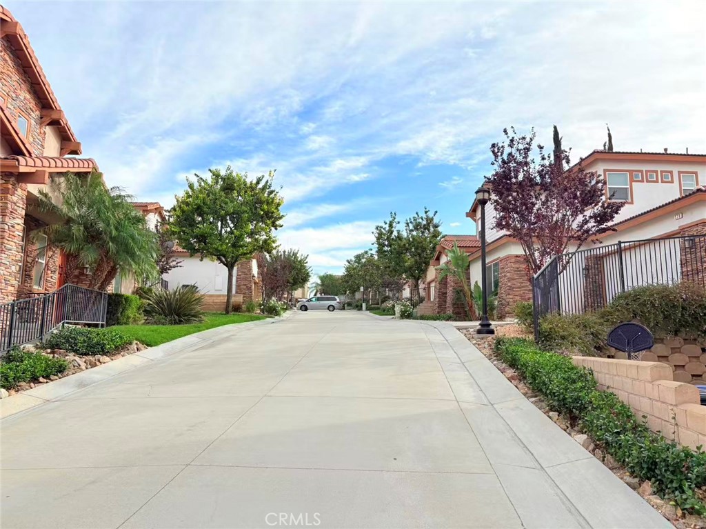 564 Vía Pueblo Riverside, CA 92507 - Photo 35 of 36 a front view of a house with a yard and trees