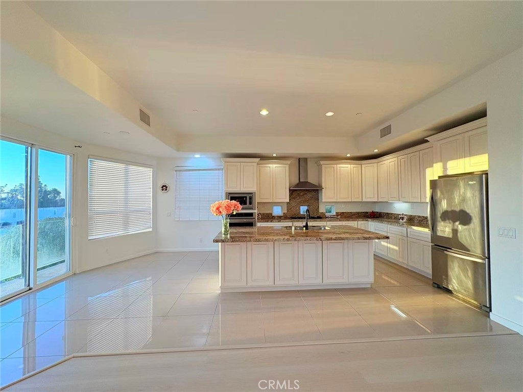 564 Vía Pueblo Riverside, CA 92507 - Photo 4 of 36 a kitchen with stainless steel appliances granite countertop a sink and cabinets