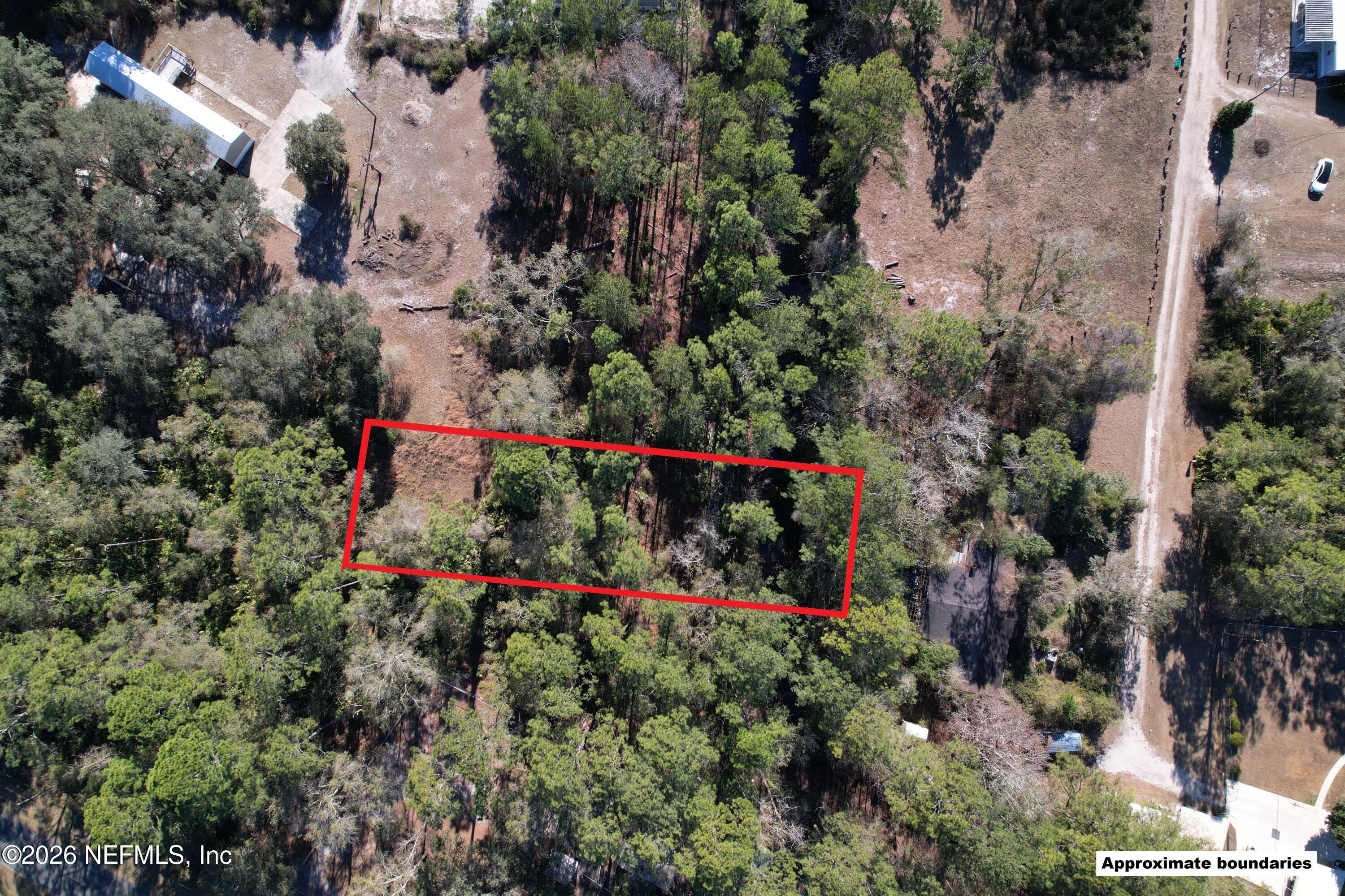115 Click Road Satsuma, FL 32189 - Photo 1 of 11 an aerial view of swimming pool and red outdoor space