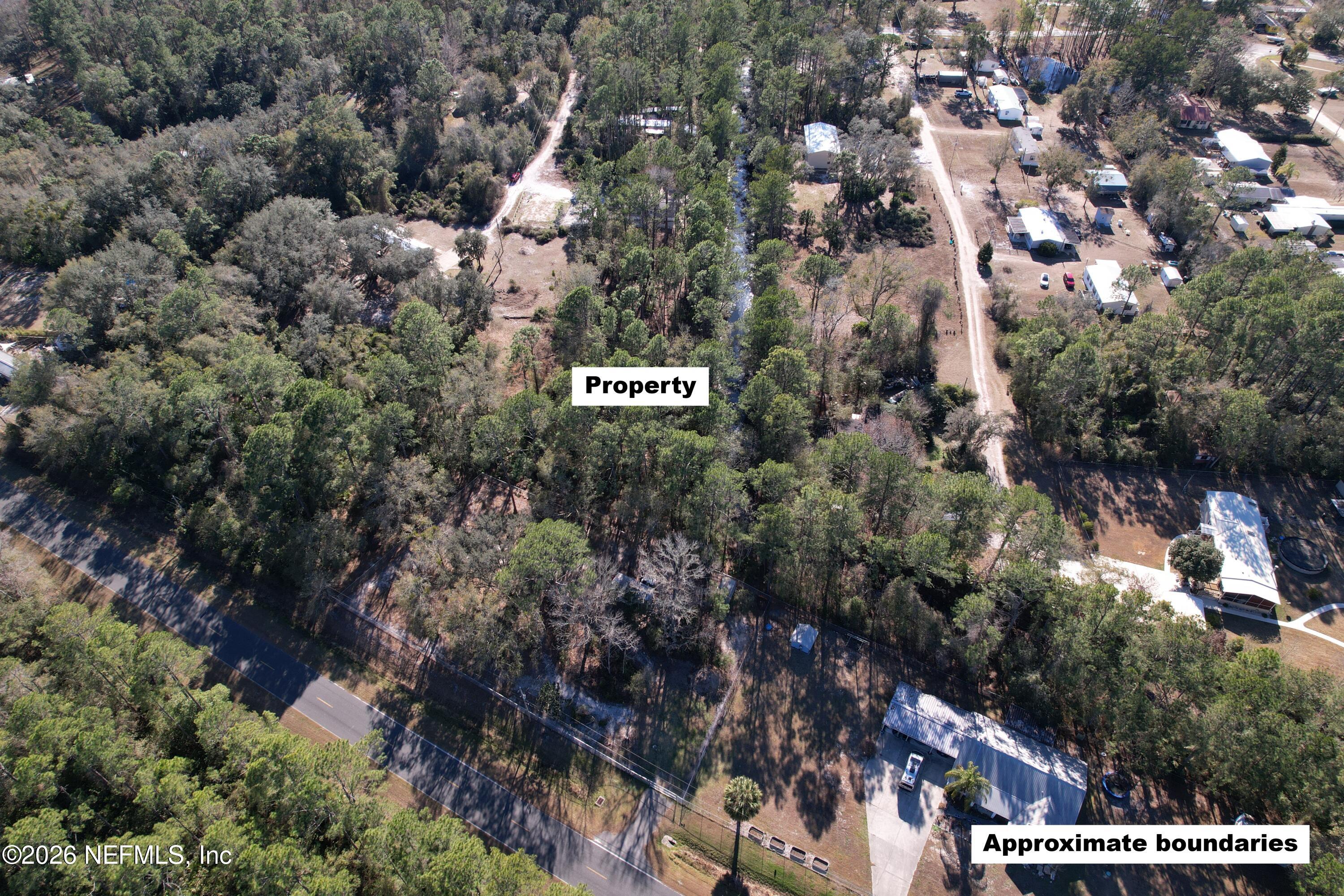 115 Click Road Satsuma, FL 32189 - Photo 2 of 11 a city view with tall trees
