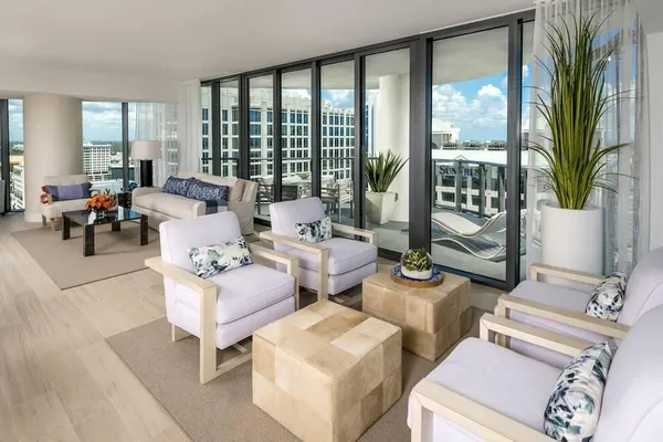 a living room with patio and a large window