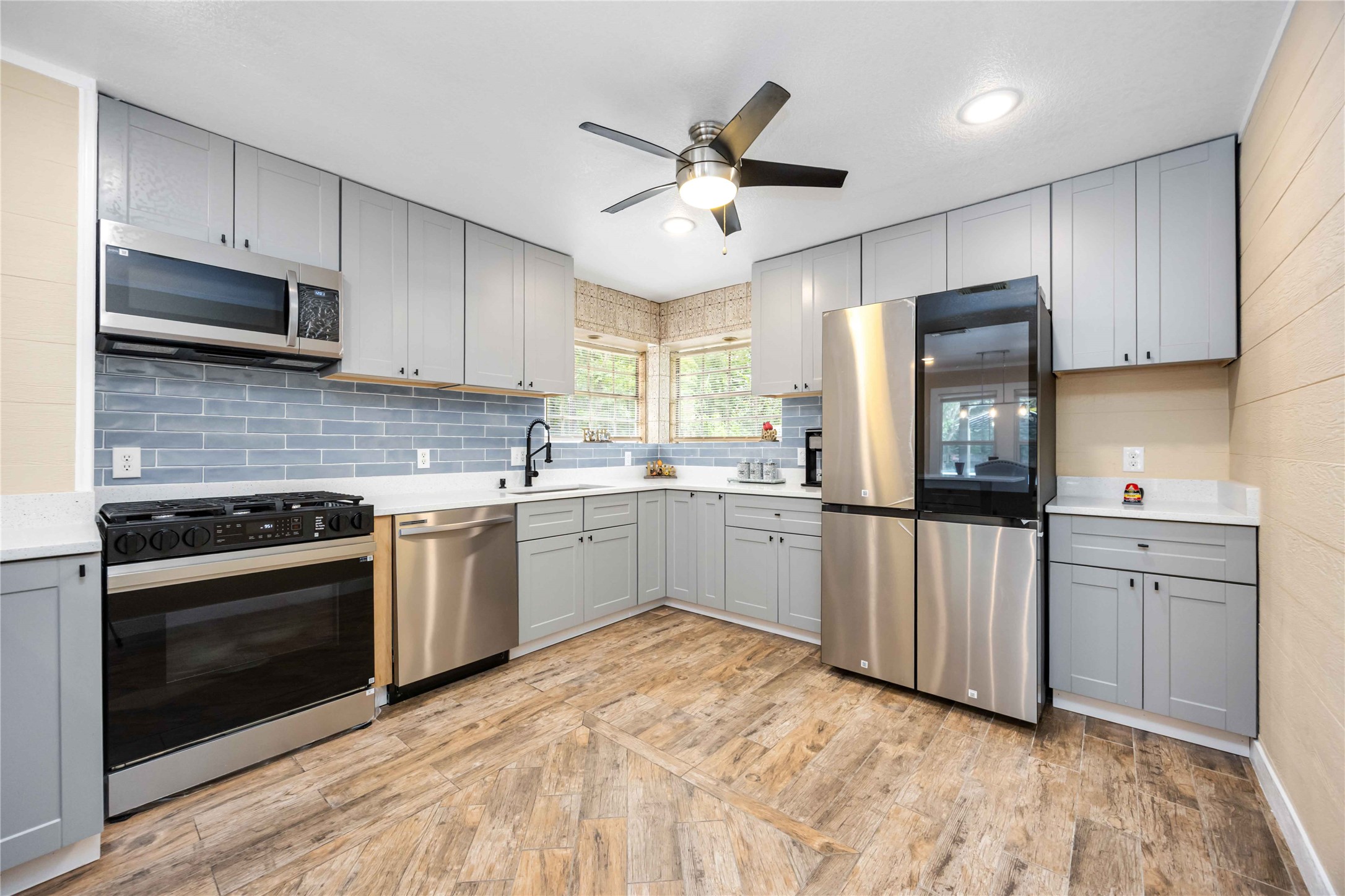 478 Brandon Road Conroe, TX 77302 - Photo 12 of 31 a kitchen with white cabinets and white appliances