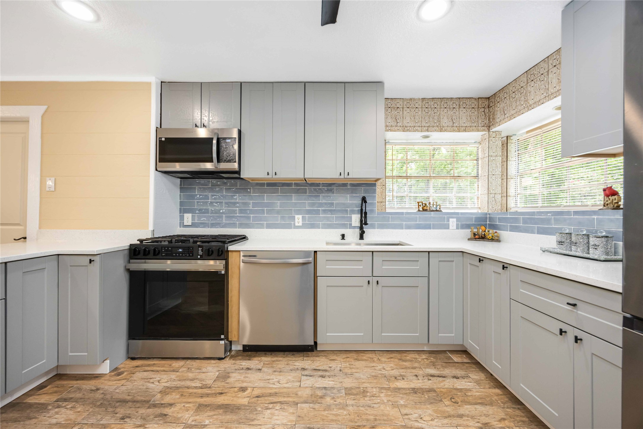478 Brandon Road Conroe, TX 77302 - Photo 13 of 31 a kitchen with white cabinets appliances and window
