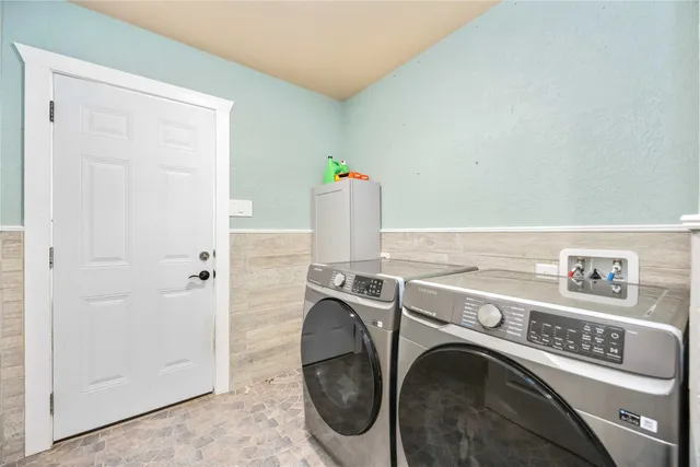 a utility room with dryer and washer