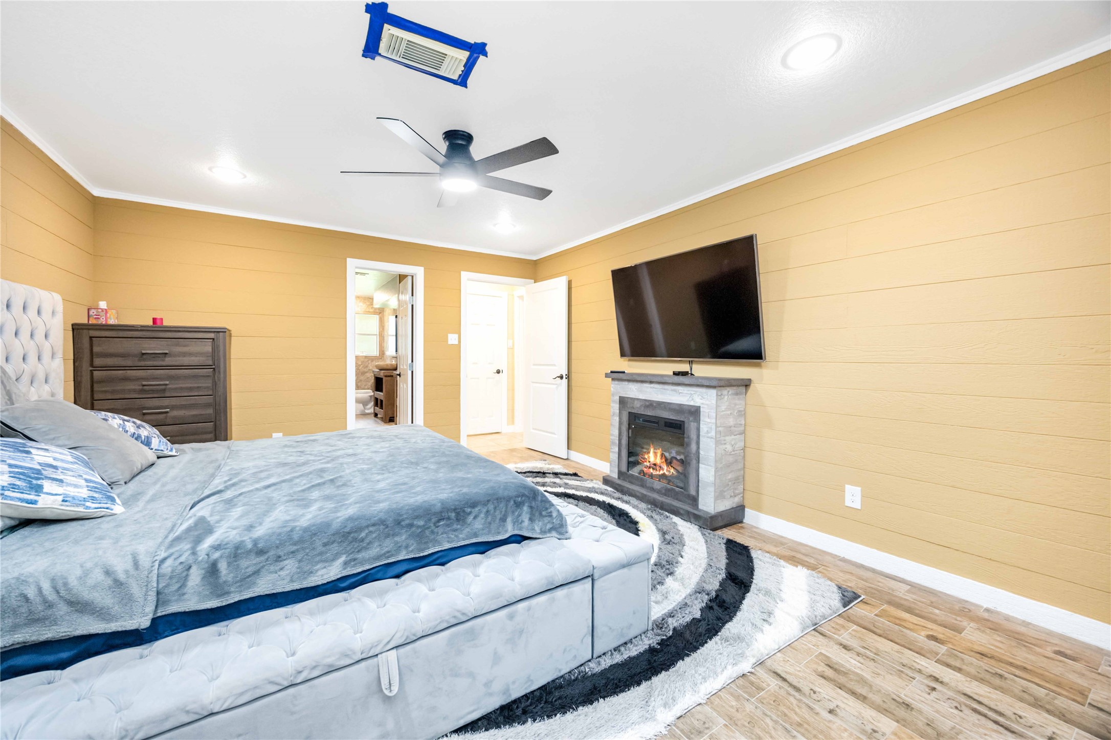 478 Brandon Road Conroe, TX 77302 - Photo 18 of 31 a bedroom with a bed and a flat screen tv