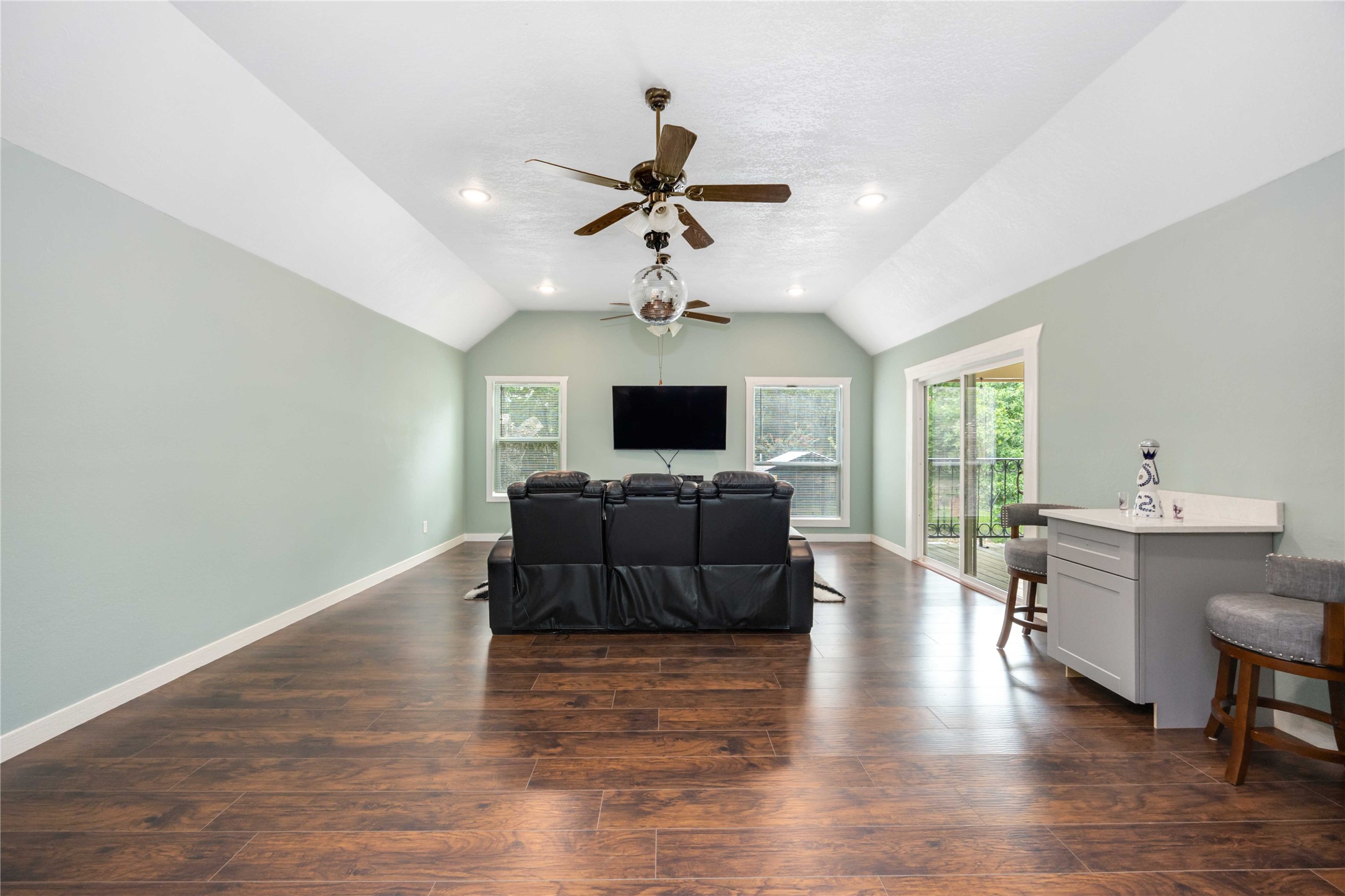 478 Brandon Road Conroe, TX 77302 - Photo 21 of 31 a living room with furniture and a flat screen tv