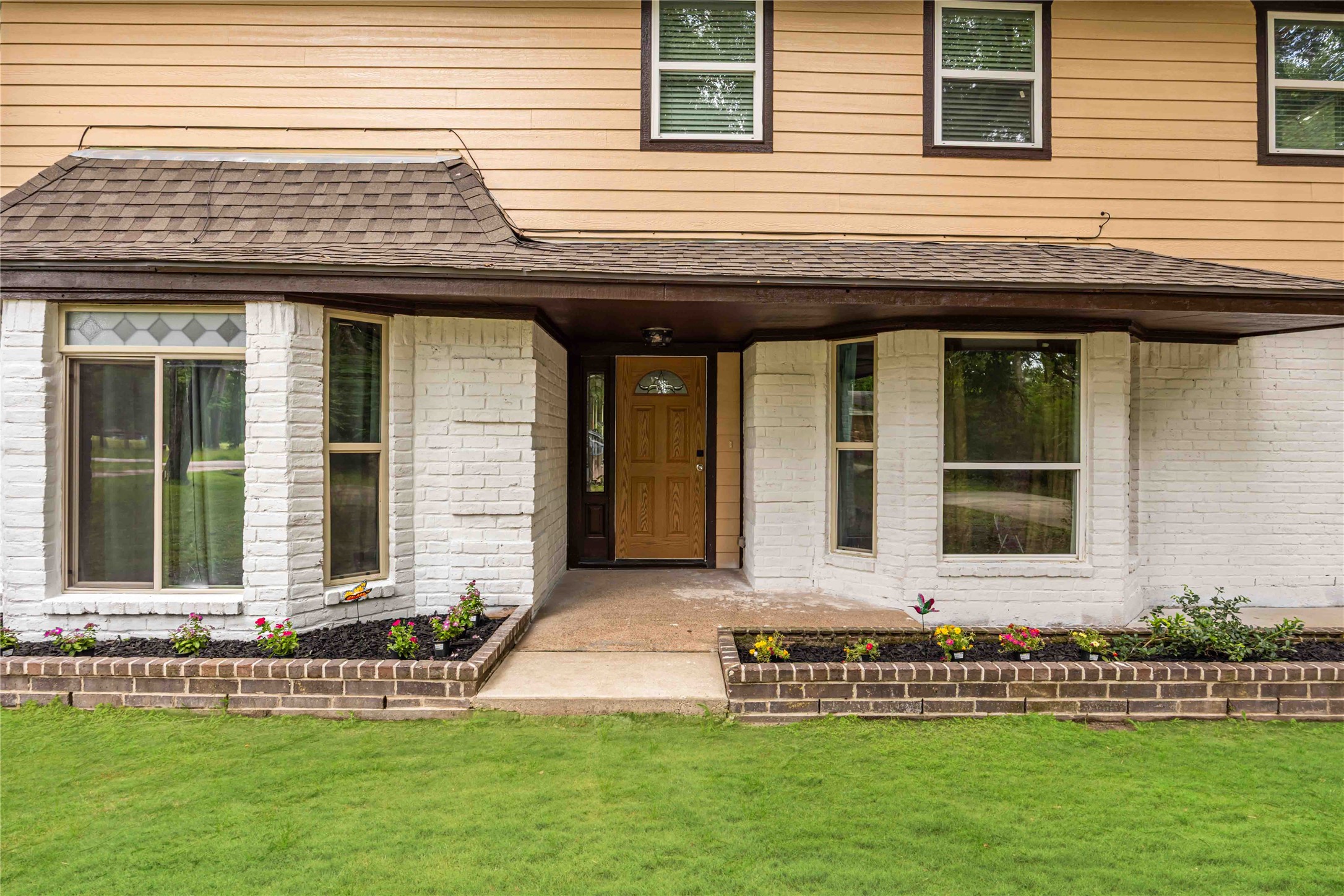 478 Brandon Road Conroe, TX 77302 - Photo 3 of 31 a front view of a house with a yard