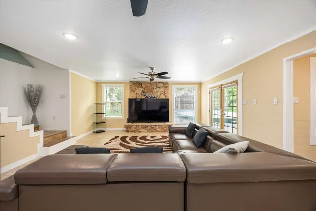 a living room with furniture and a flat screen tv