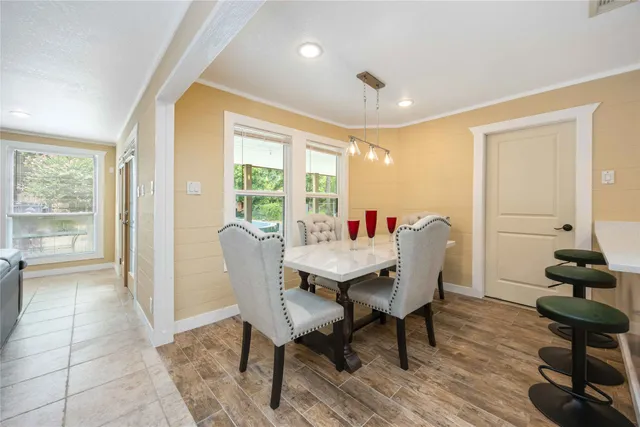 a view of a dining room with furniture window and outside view