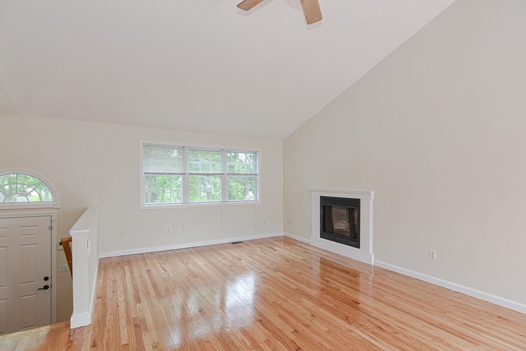 28 Aroostook Street Worcester, MA 01606 - Photo 13 of 40 an empty room with wooden floor and windows