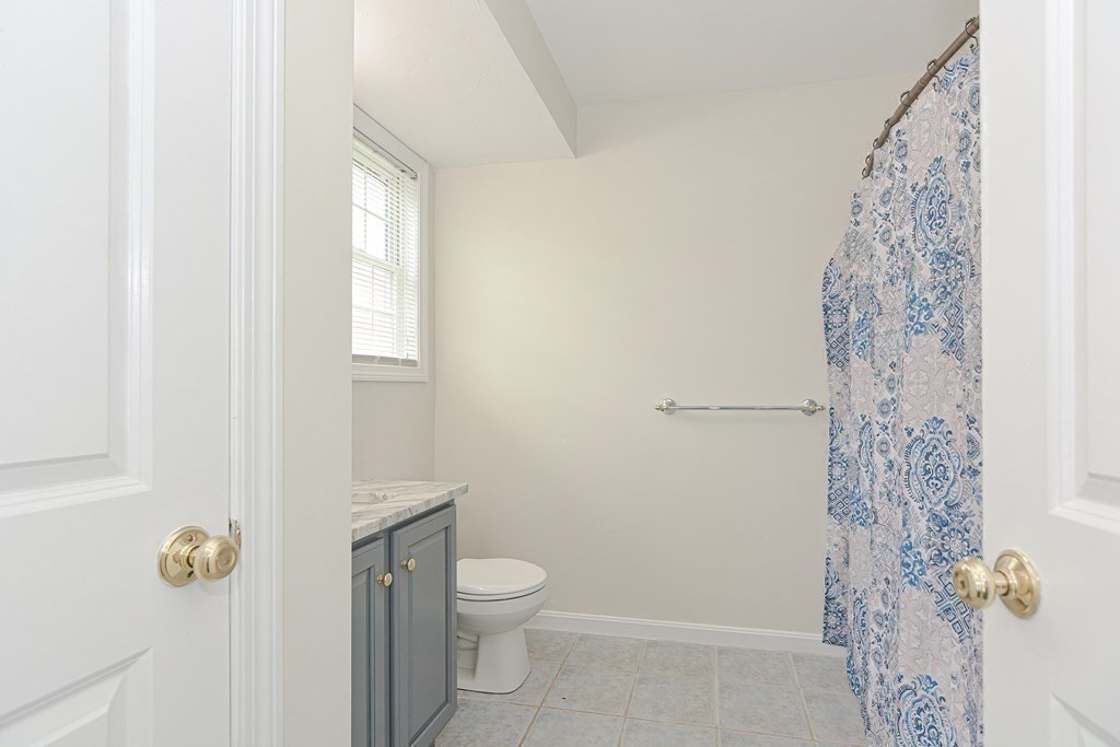 28 Aroostook Street Worcester, MA 01606 - Photo 16 of 40 a bathroom with a toilet sink and shower