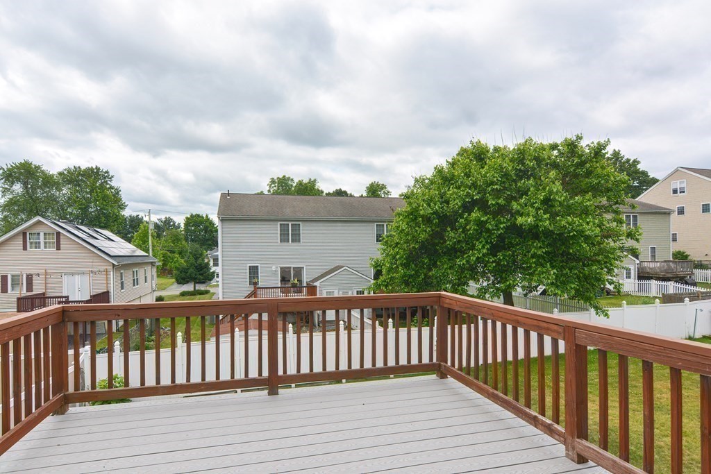 28 Aroostook Street Worcester, MA 01606 - Photo 33 of 40 a balcony with wooden floor and fence