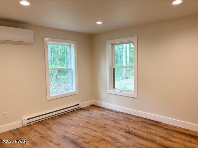 112 Ridge Drive Milford, PA 18337 - Photo 18 of 22 an empty room with wooden floor and windows