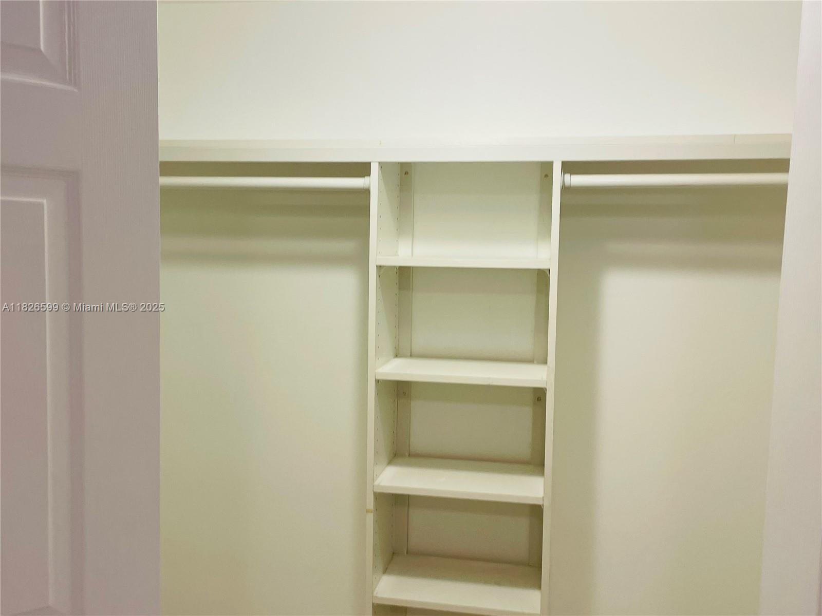 180 Northeast 12th Avenue, Unit 11E Hallandale Beach, FL 33009 - Photo 15 of 22 a hallway with closet