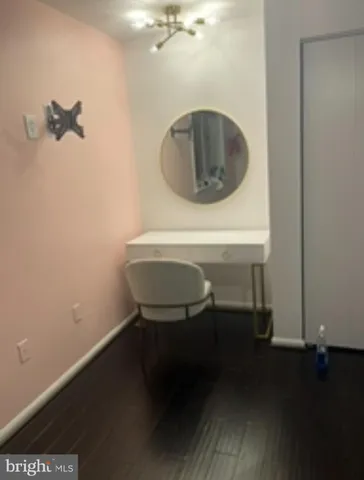 a bathroom with a sink toilet and a mirror