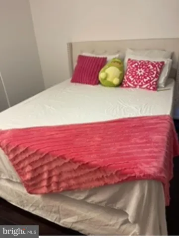 a view of bedroom and an empty room