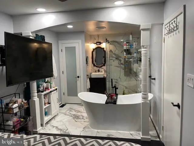 a living room with furniture and a flat screen tv