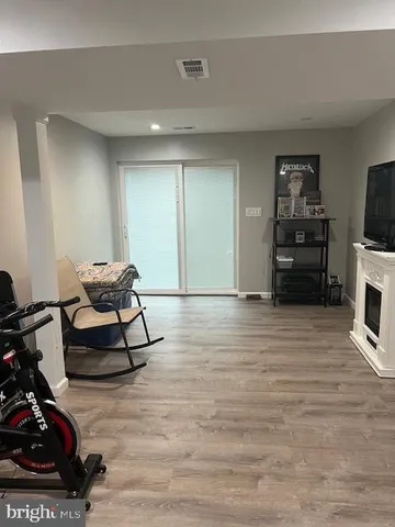 a view of a bathroom with wooden floor