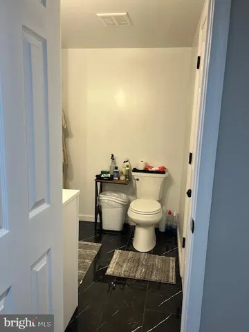 a bathroom with a sink a mirror and shower