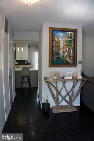 a view of a workspace with furniture wooden floor and windows