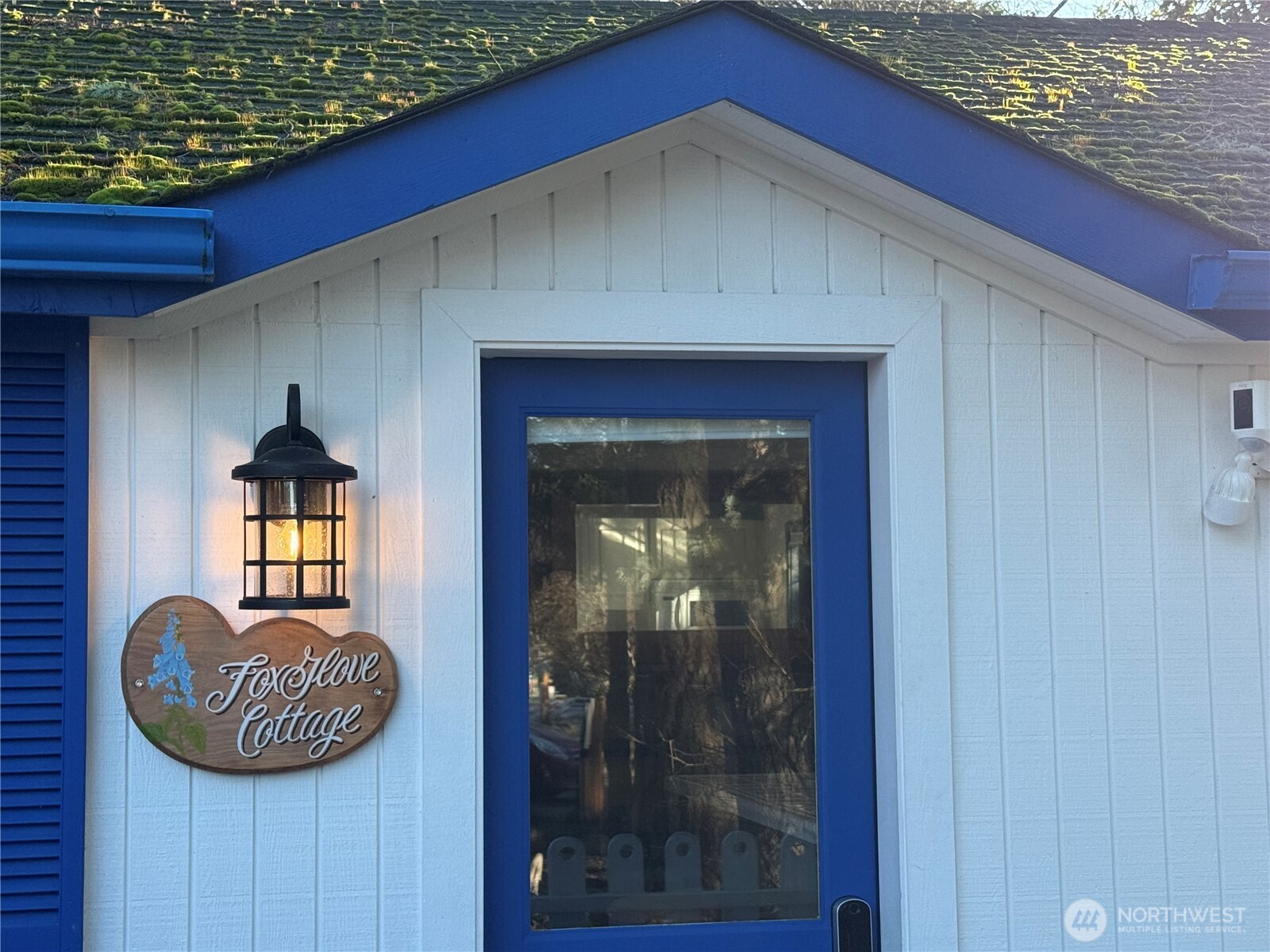 5244 Deer Harbor Road Orcas Island, WA 98243 - Photo 3 of 38 a view of a hallway with a couch and chandelier