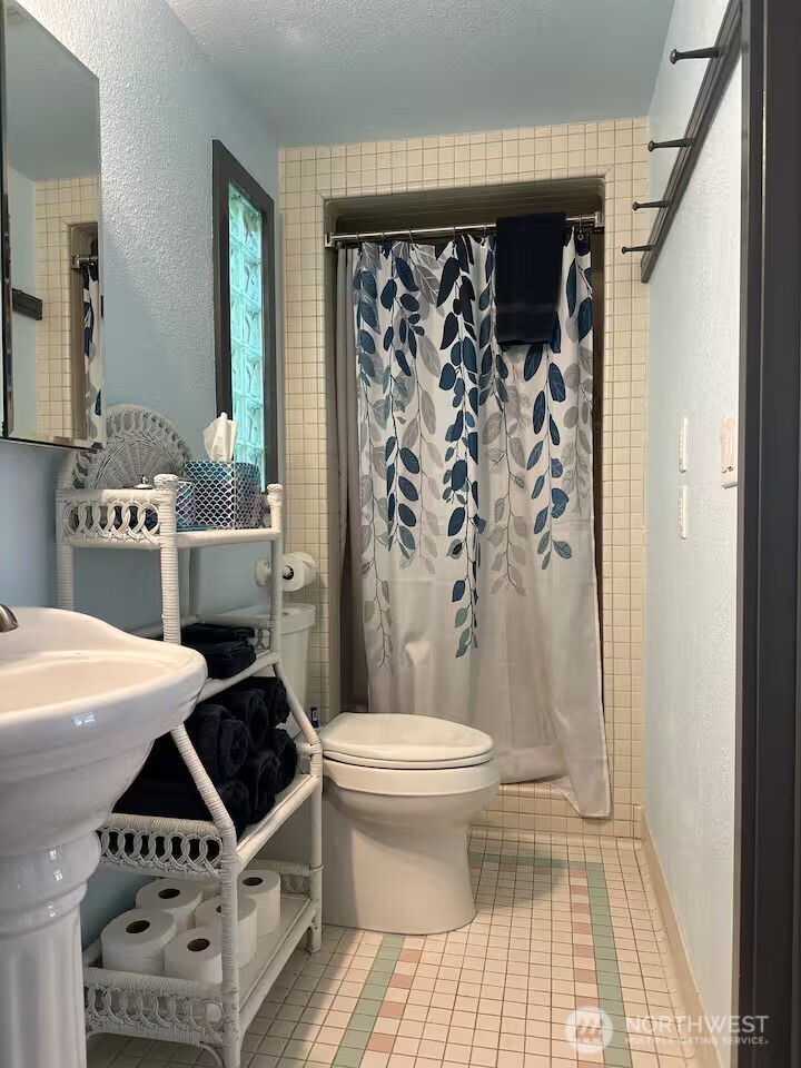 5244 Deer Harbor Road Orcas Island, WA 98243 - Photo 35 of 38 a bathroom with a sink toilet and shower