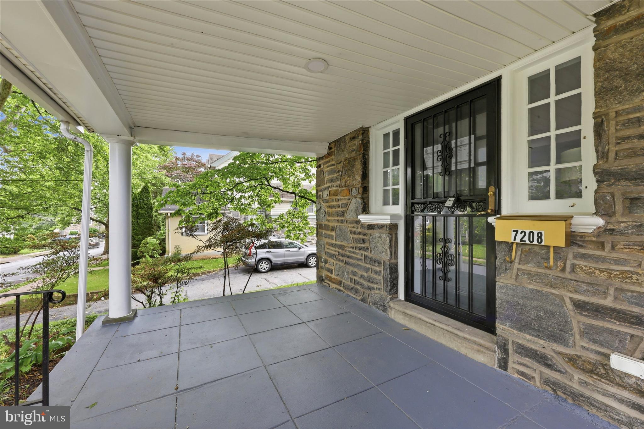 7208 Hilltop Road Upper Darby, PA 19082 - Photo 4 of 28 a view of a porch with chairs and table in the patio