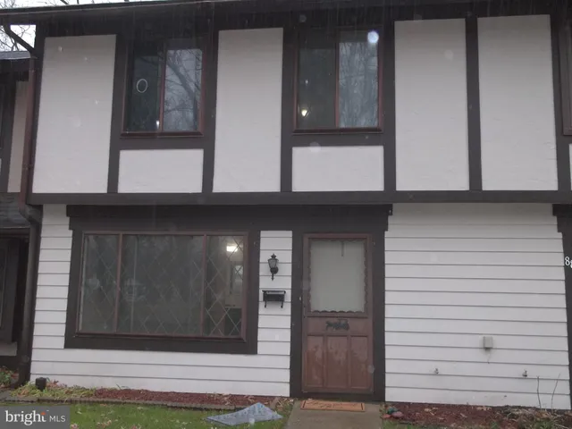 a view of kitchen with granite countertop cabinets