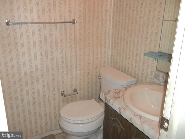 a bathroom with a sink and toilet