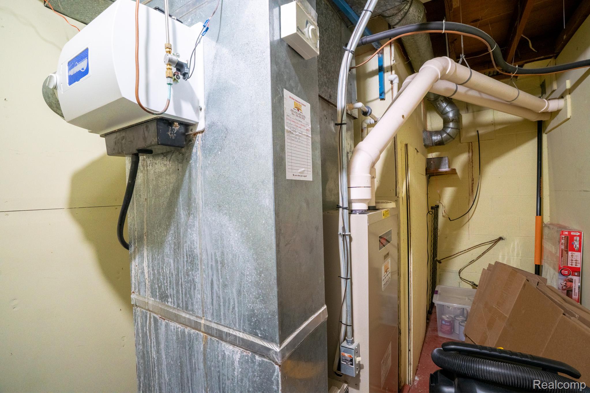 7333 Toma Road Dexter, MI 48130 - Photo 44 of 45 Utility area featuring a furnace, attached humidifier, and exposed ductwork