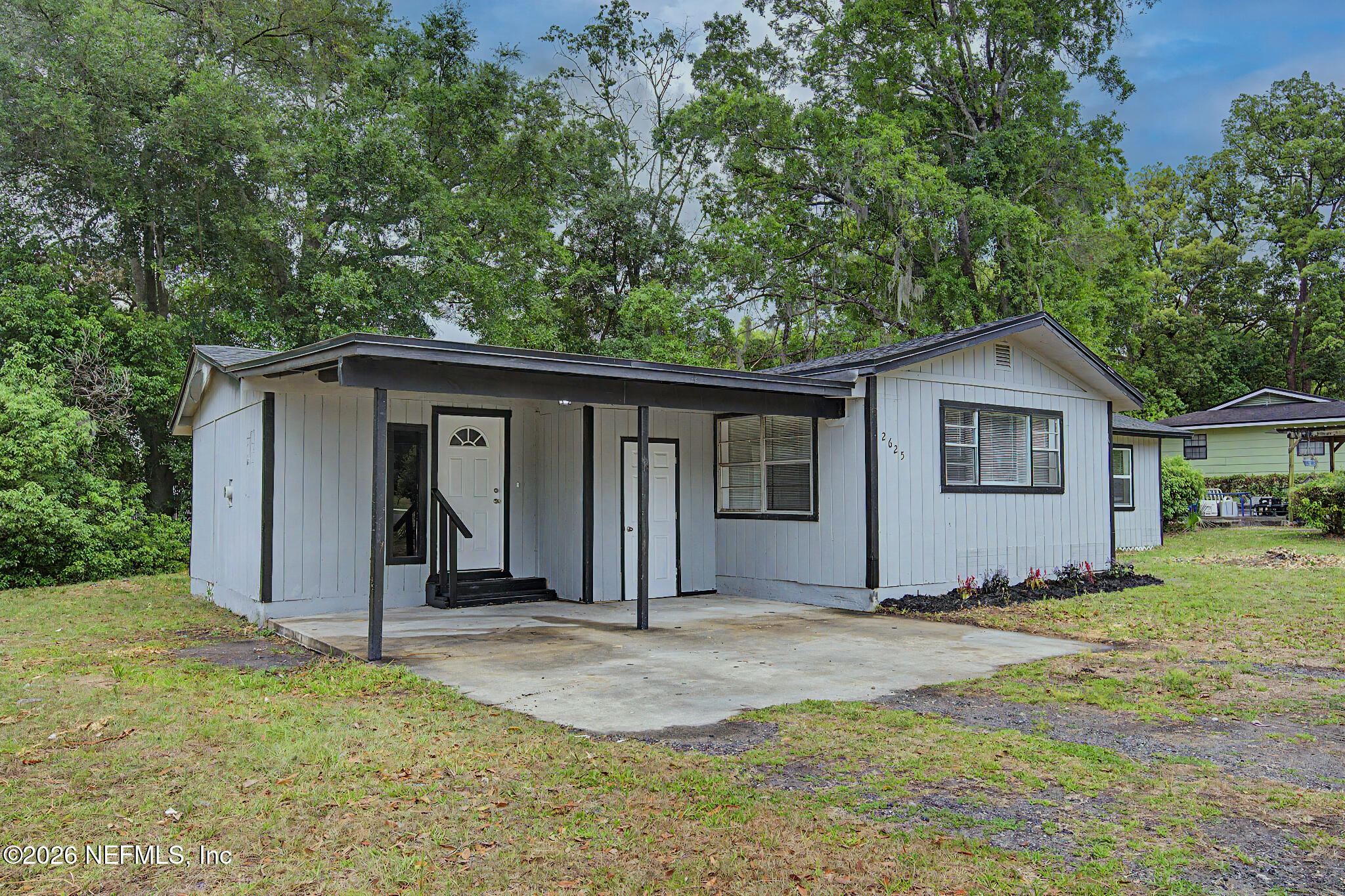2625 Kohn Road Jacksonville, FL 32210 - Photo 28 of 34 a view of a house with yard and a tree