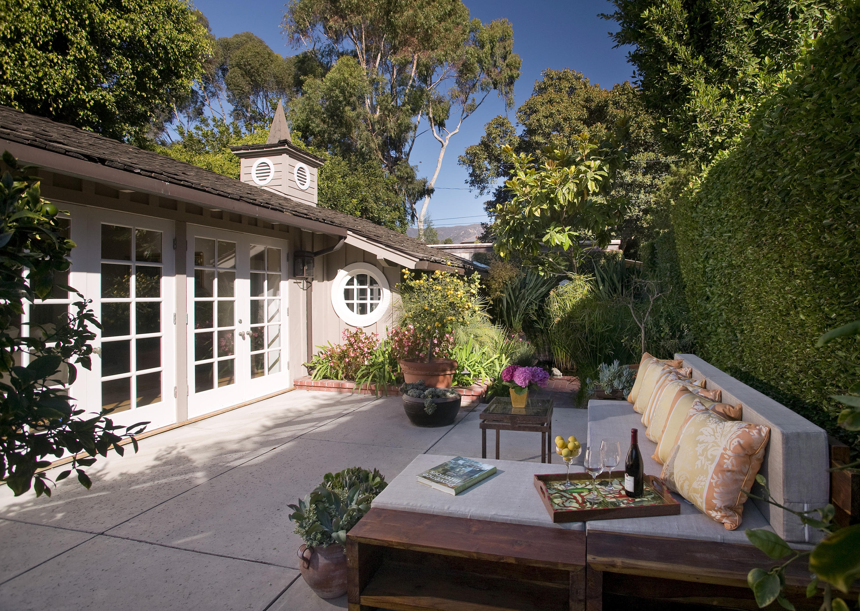 1153 High Road Santa Barbara, CA 93108 - Photo 1 of 1 a view of a patio with table and chairs and potted plants