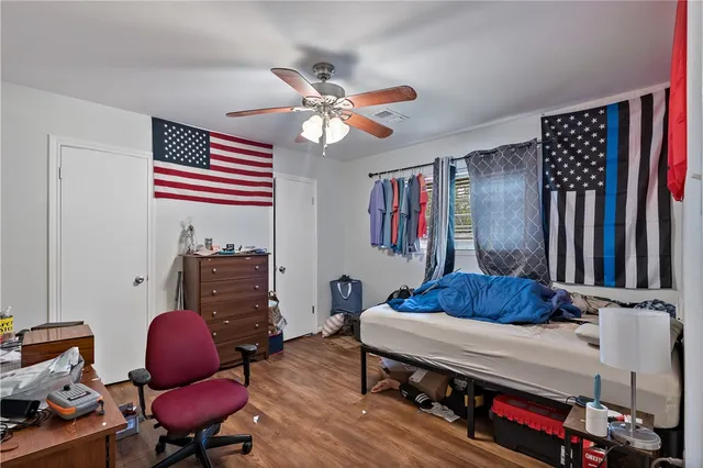 a living room with furniture and a chair