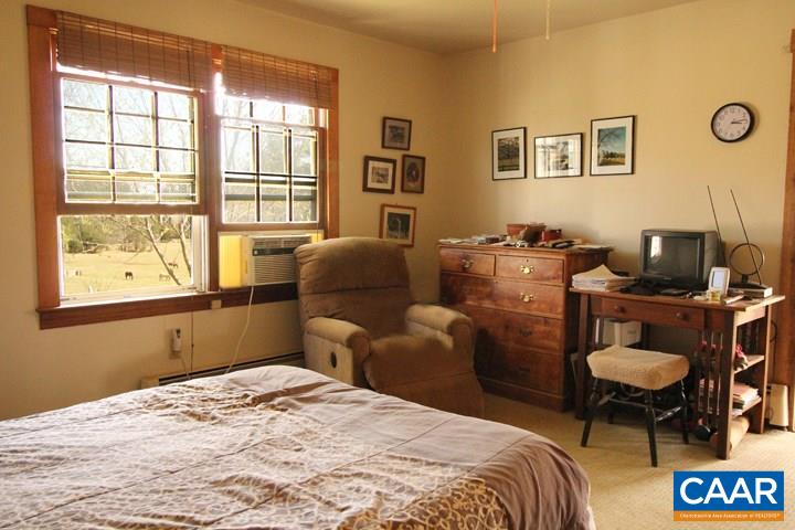 7814 Chestnut Grove Road Esmont, VA 22937 - Photo 11 of 28 a bedroom with furniture and a window