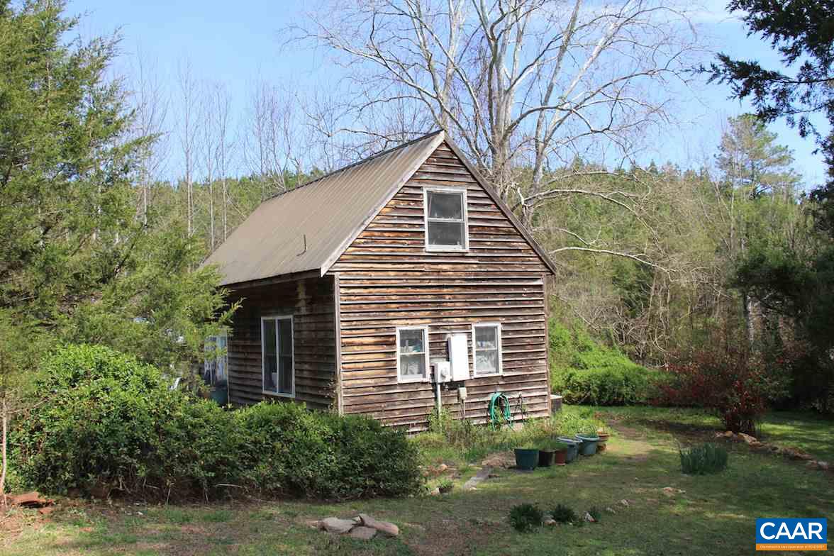 7814 Chestnut Grove Road Esmont, VA 22937 - Photo 13 of 28 a front view of a house with a yard