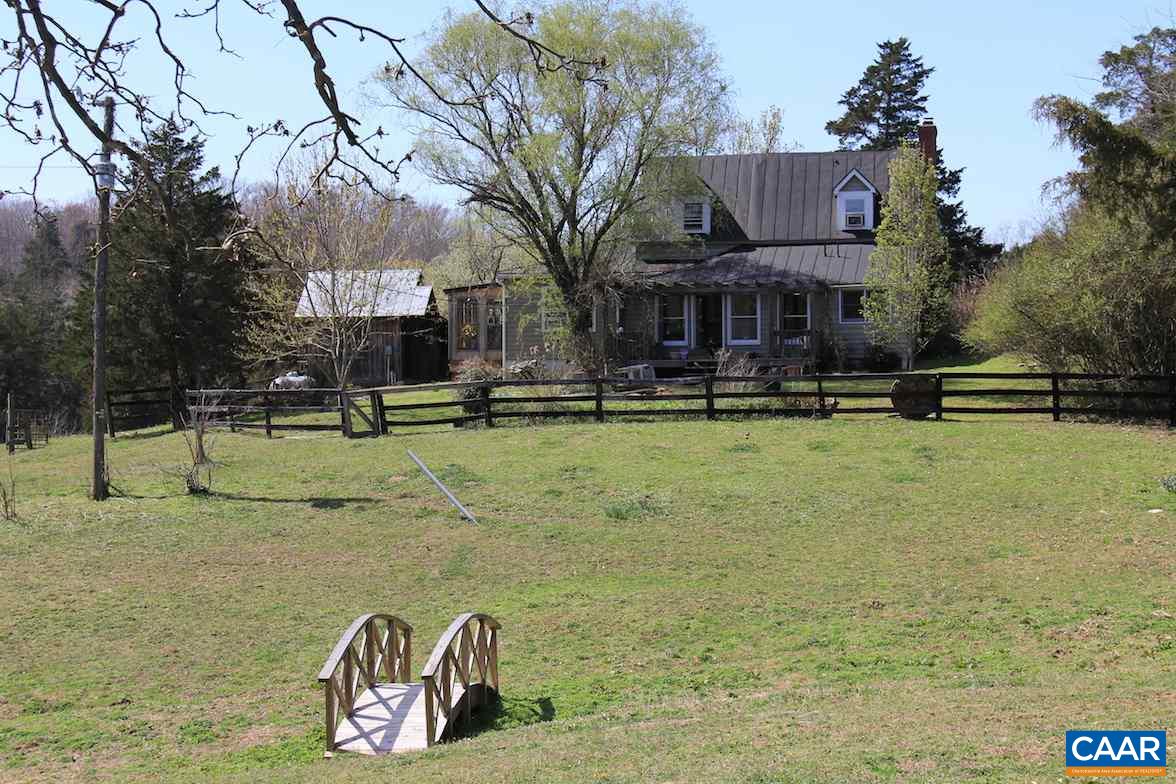 7814 Chestnut Grove Road Esmont, VA 22937 - Photo 2 of 28 a front view of a house with garden