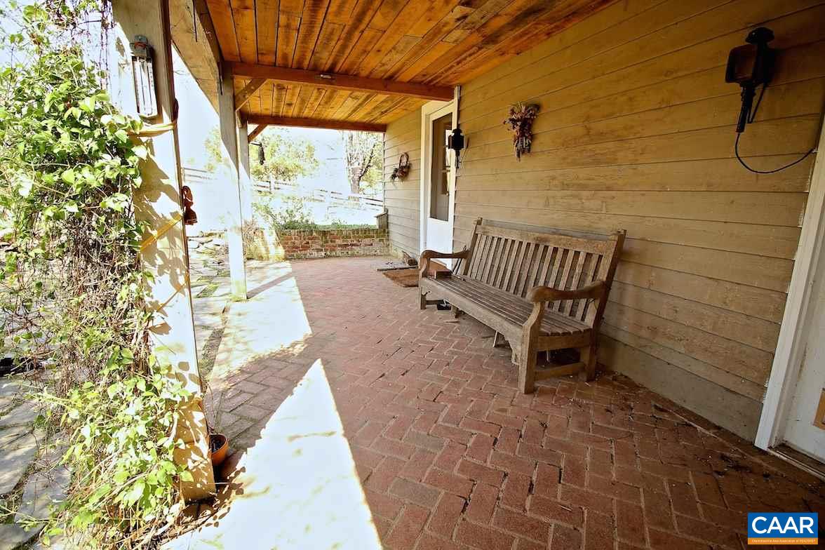 7814 Chestnut Grove Road Esmont, VA 22937 - Photo 4 of 28 a view of a patio with a table and chairs