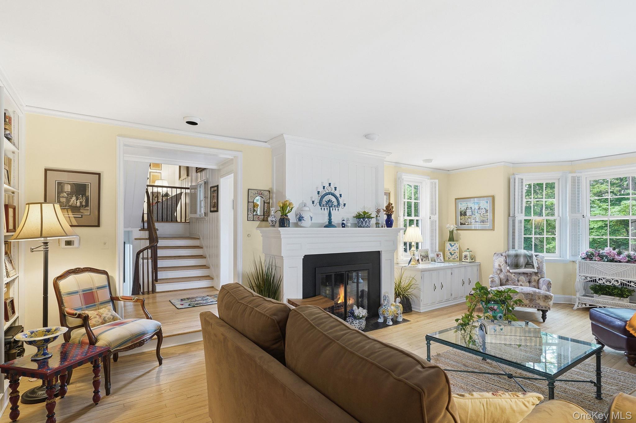 26 Cedarlawn Road Irvington, NY 10533 - Photo 5 of 34 a living room with furniture and a fireplace