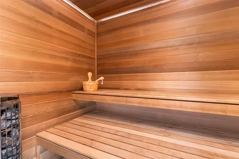 a living room with furniture a rug and a window